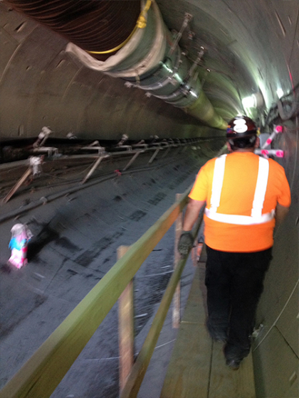 Sundancer Electric team member walking through tunnel