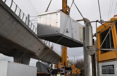 Crane moving shipping container